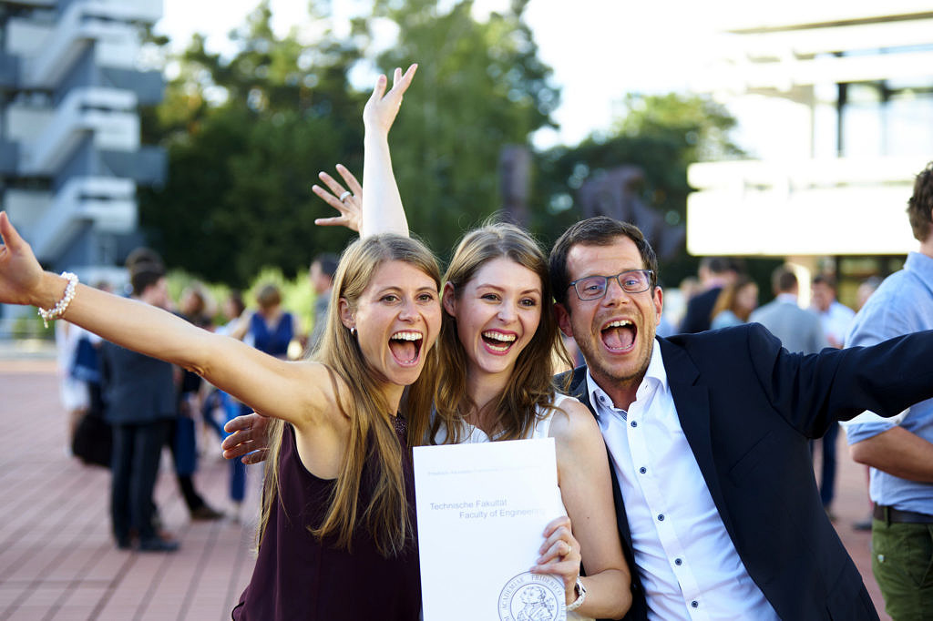 Graduates with their father