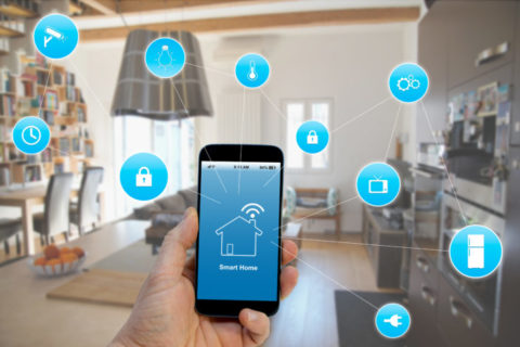 a hand holding a cell phone showing Smart Home App