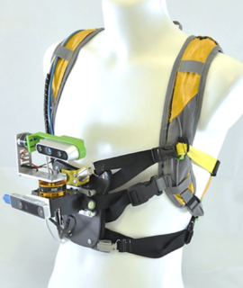 The LOMOBI system can be carried like a backpack. It is equipped with a camera on the front which feeds the system with data about the surroundings in real-time.